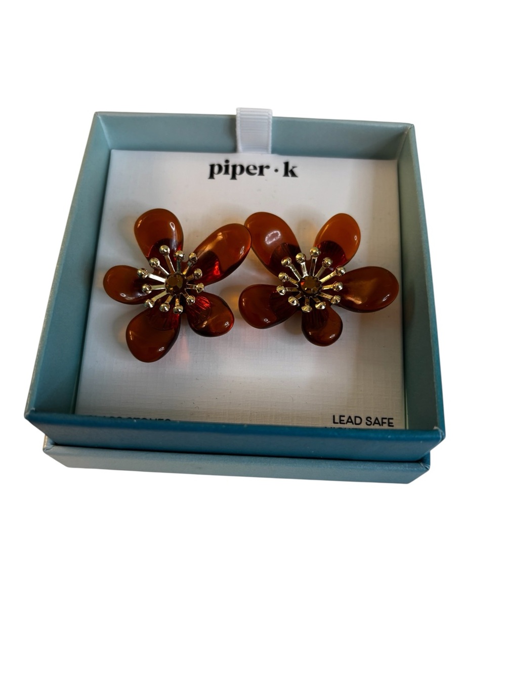 Floral stud earrings w/ translucent Amber petals & gold tone sunburst centers.